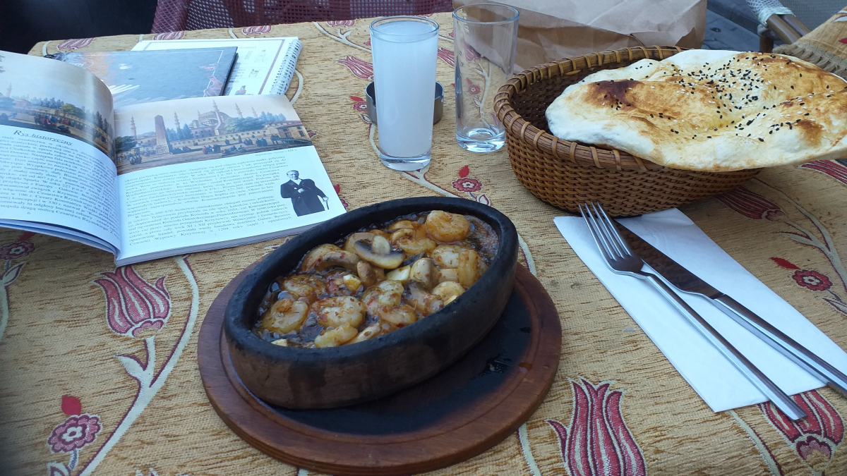 A traditional Turkish clay-pot kebab with fresh pide bread in Istanbul